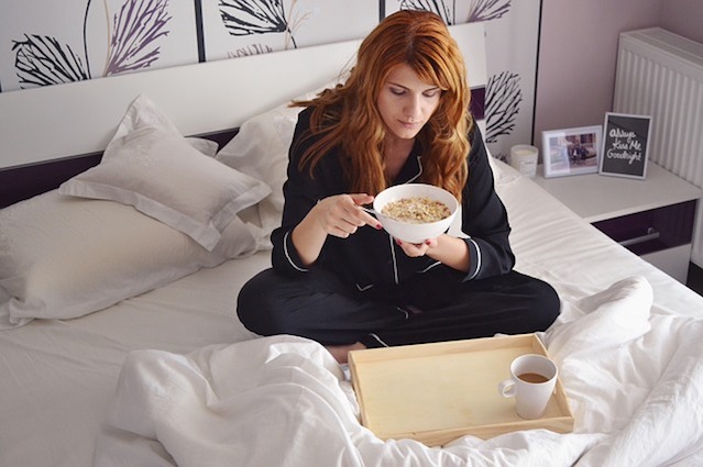 woman on bed bug infested bed